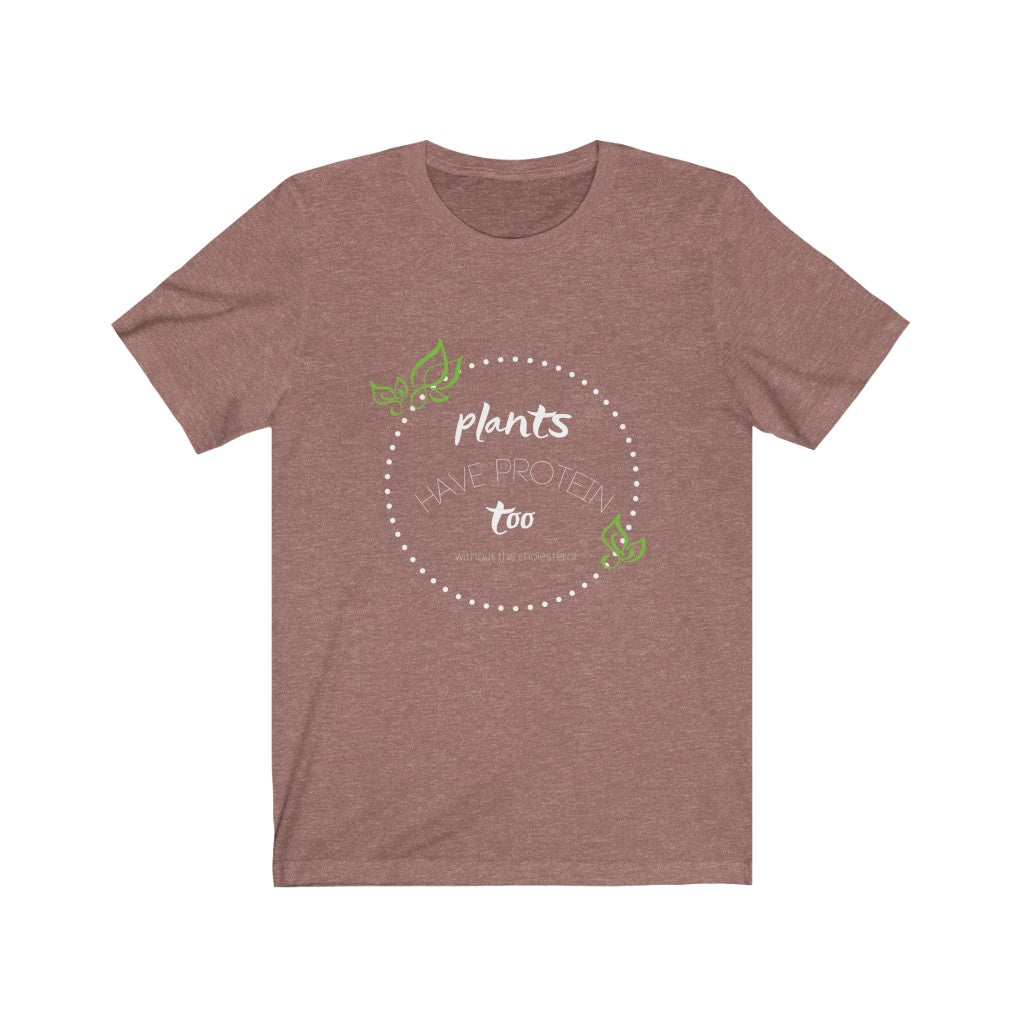 heather mauve vegan shirt with white and green design saying plants have protein too without the cholesterol laying flat on white background, from ethical clothing brands and companies that donate to nonprofits