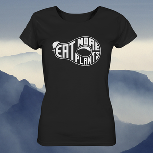Organic ladies fitted scoop neck t-shirt in black saying Eat More Plants with foggy mountain background