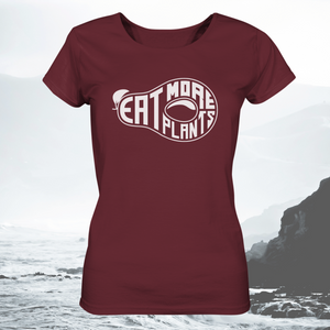 Organic ladies fitted scoop neck t-shirt in burgundy saying Eat More Plants on rocky coastal landscape