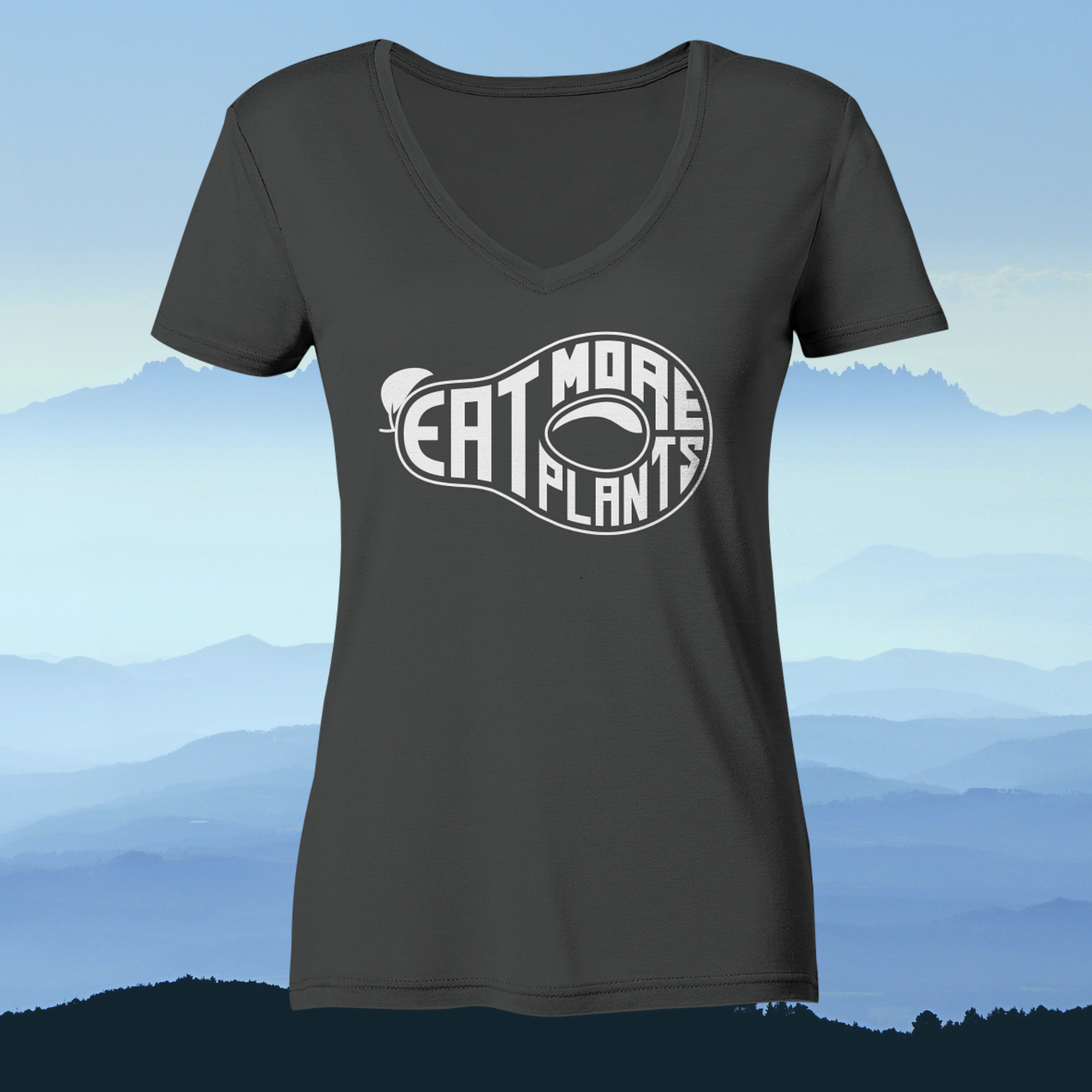 Organic ladies' v-neck vegan tshirt in grey saying eat more plants on a foggy mountain background