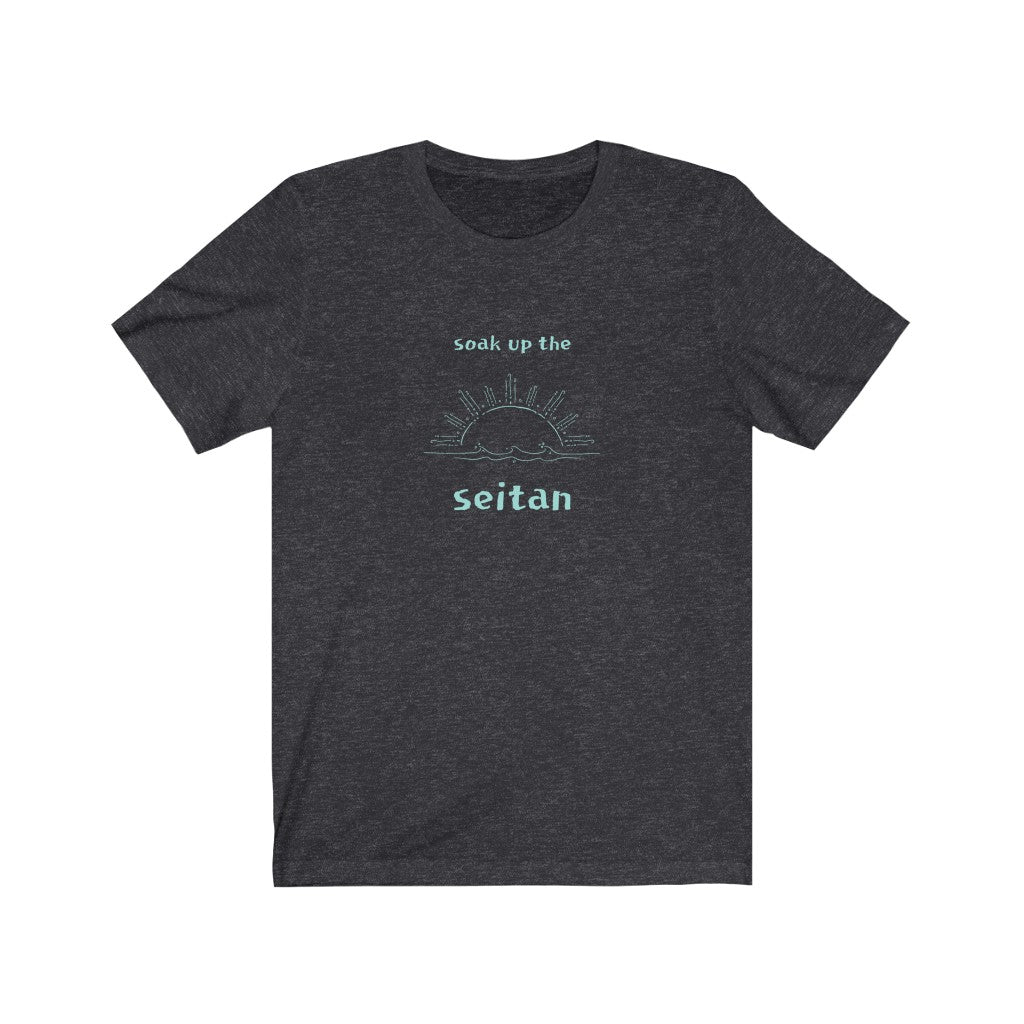 dark grey heather vegan t shirt with a teal design saying soak up the seitan