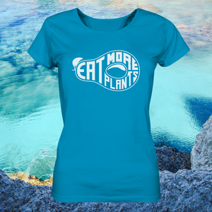 Organic ladies fitted scoop neck t-shirt in azul blue saying Eat More Plants on coastal water background