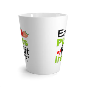 Latte mug saying eat plants lift iron, side view