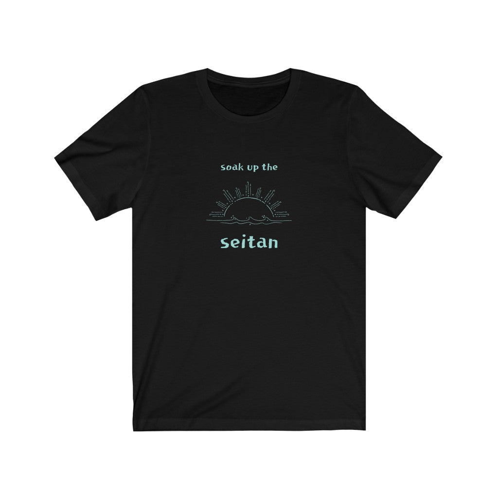 black vegan t shirt with a teal design saying soak up the seitan