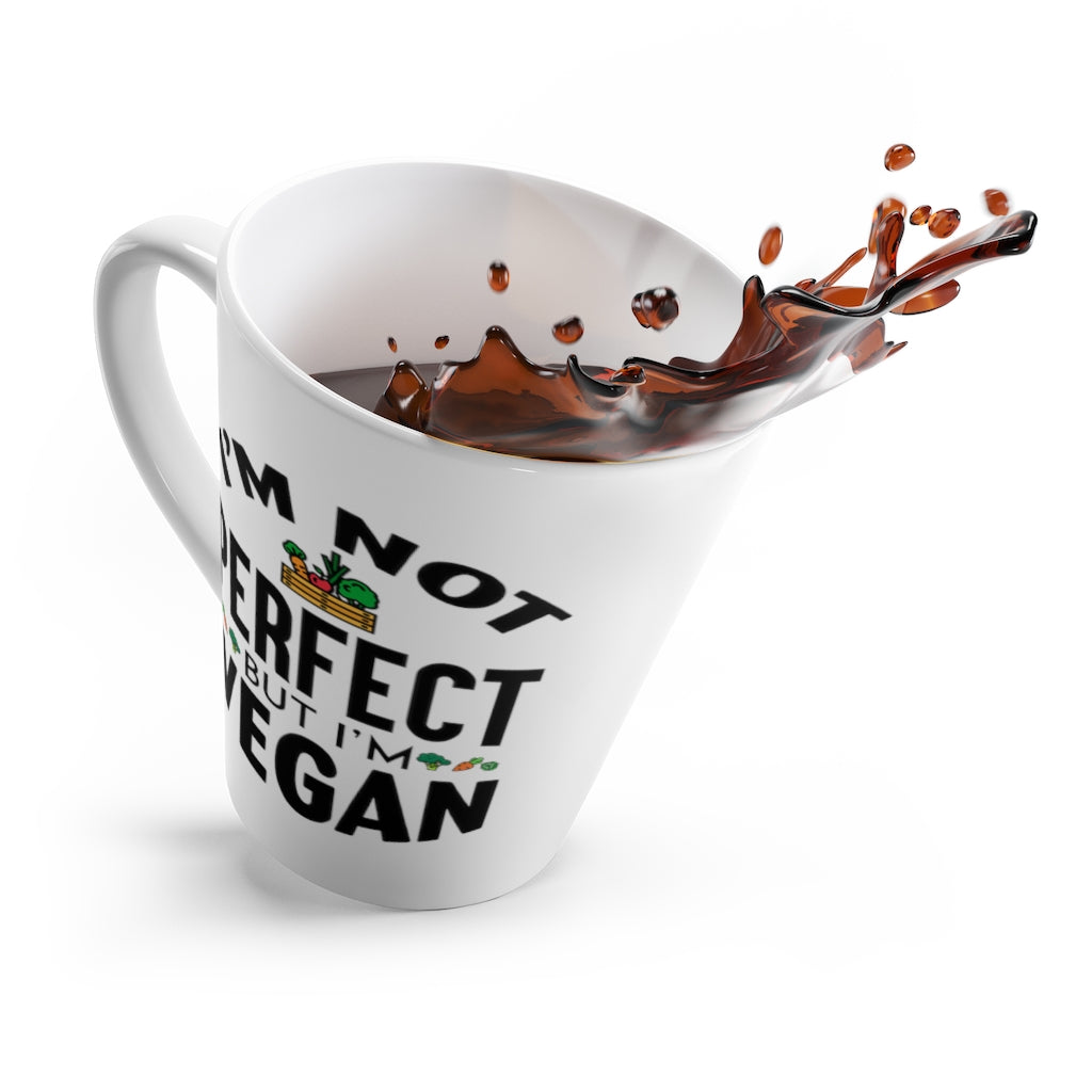 vegan latte mug saying I'm not perfect but I'm vegan, tipping over with coffee spilling out