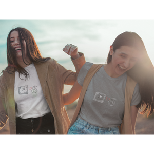 Avocado toast design with toast, heart, and avocado, worn by two women, vegan couple wearing couples shirts on a sunny day laughing