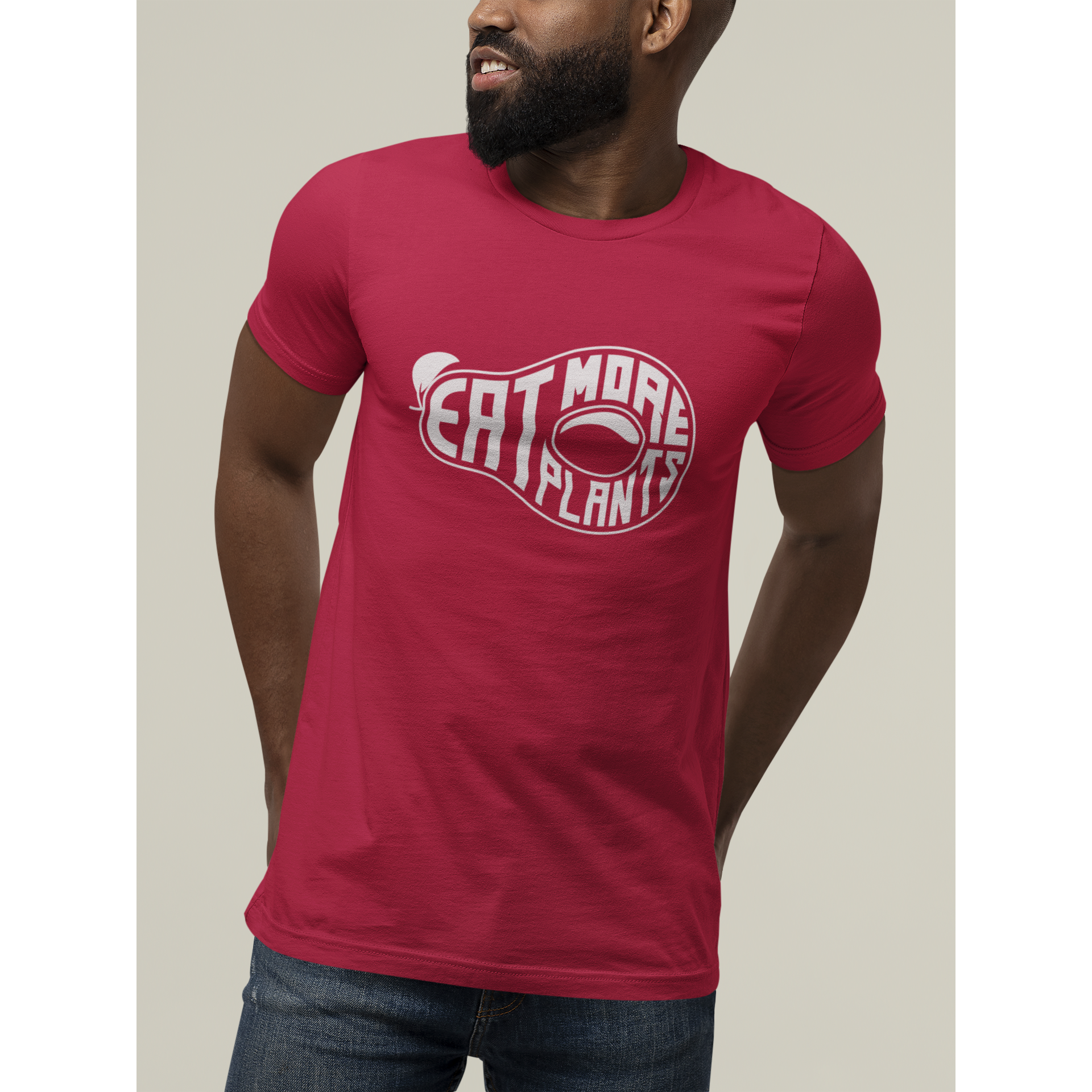 eat more plants on red vegan t shirt worn by man standing