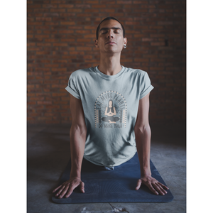 Man doing yoga on yoga mat with "eat more plants, do more yoga" boho style design in grey and light tan-pink, on a light blue yoga tops, vegan workout clothes from ethical clothing brands