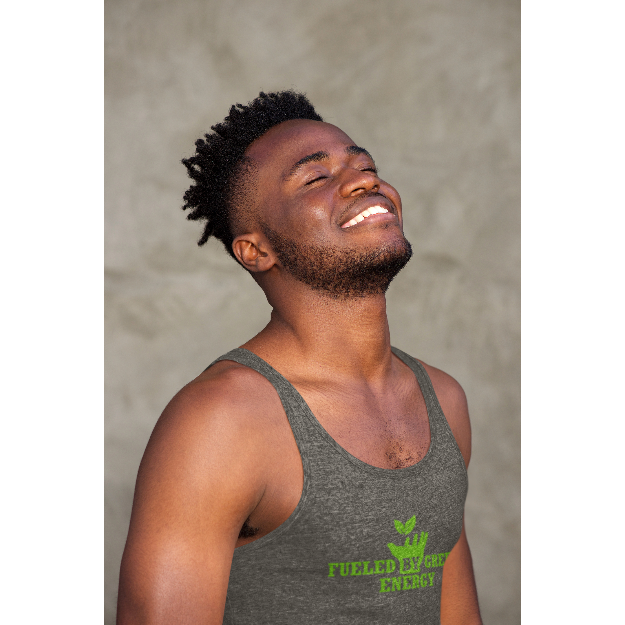 vegan tank top saying fueled by green energy worn by a smiling man