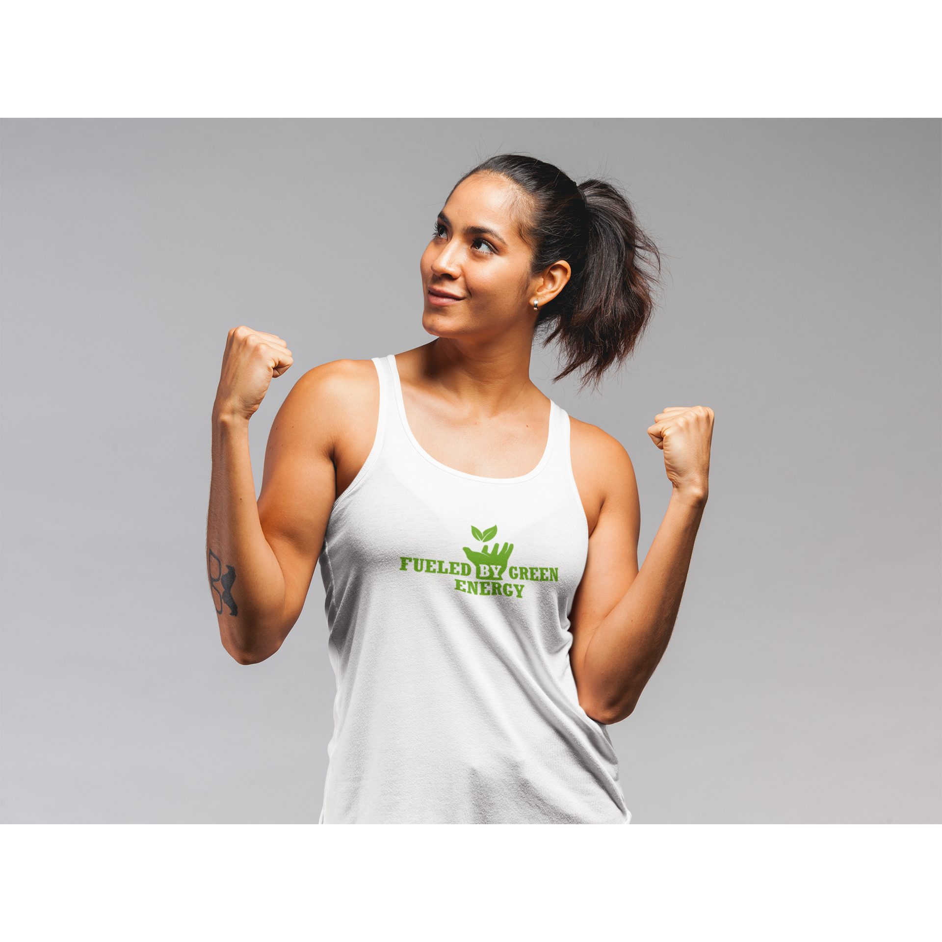 vegan tank top saying fueled by green energy worn by a woman flexing her biceps