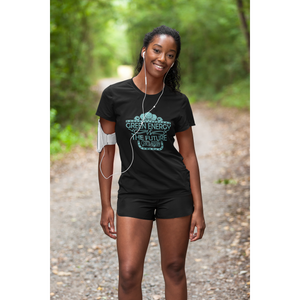 woman runner on trail with trees wearing black vegan shirt saying "green energy is the future, go vegan", from ethical clothing brands and companies that donate to nonprofits