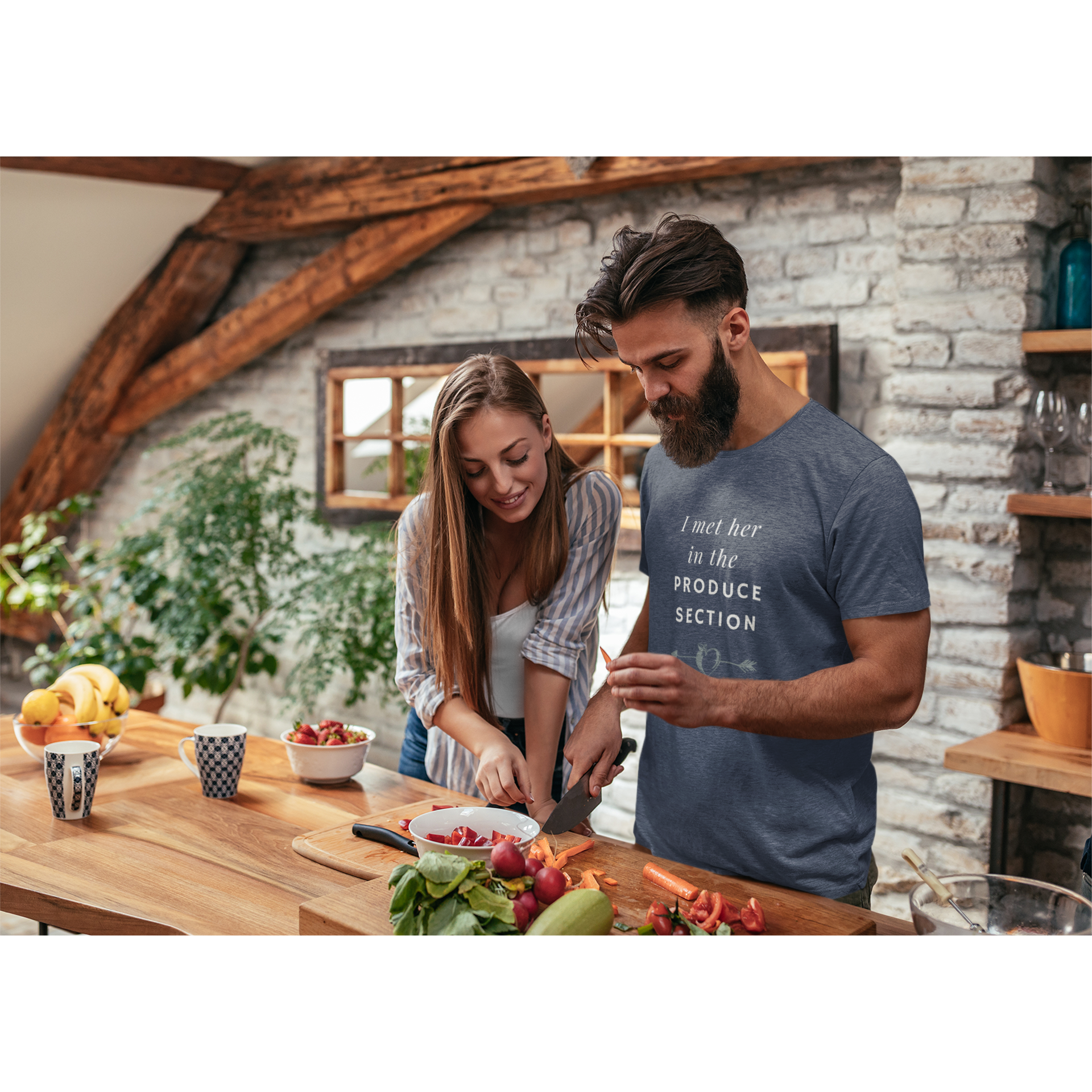 man wearing I met her in the produce section design for vegan couples with white words and a grey arrow through a heart-shaped peach on a heather navy colored vegan t shirt, from ethical clothing brands and companies that donate to nonprofits