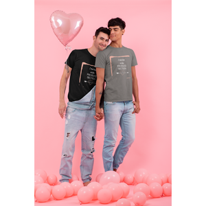 two men standing with pink balloons, male vegan couple wearing black and asphalt colored vegan t-shirts with I met him in the produce section words with an arrow through a heart and a pink painted frame 