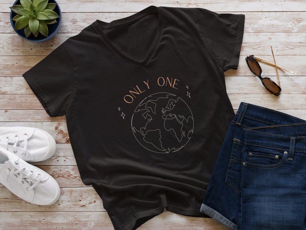 Black organic cotton vegan t-shirt saying Only One Earth laid flat with outfit
