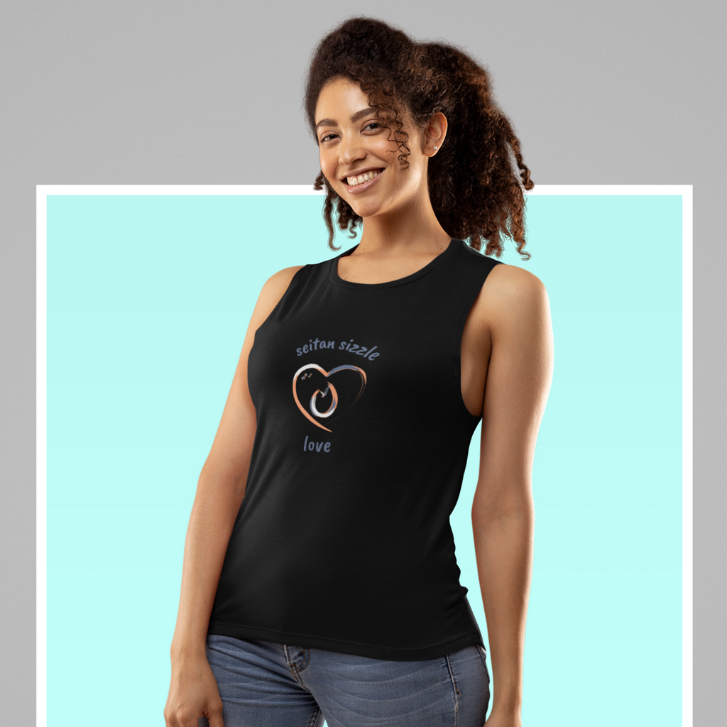 woman wearing black vegan tank tops with a brushed design using grey pink and white colors saying seitan sizzle love