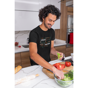 vegan protein word salad in fall colors on a black vegan t-shirt worn by a man in a kitchen