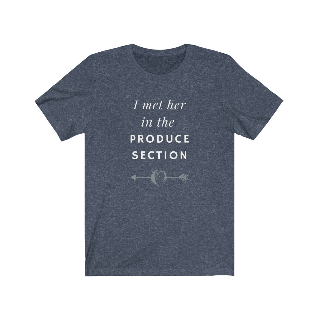 design for vegan couples with white words and a grey arrow through a heart-shaped peach on a heather navy colored vegan t shirt, from ethical clothing brands and companies that donate to nonprofits
