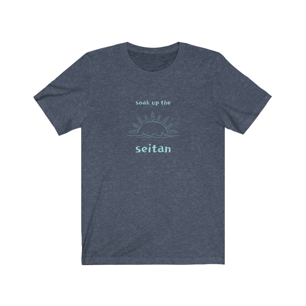 heather navy vegan t shirt with a teal design saying soak up the seitan