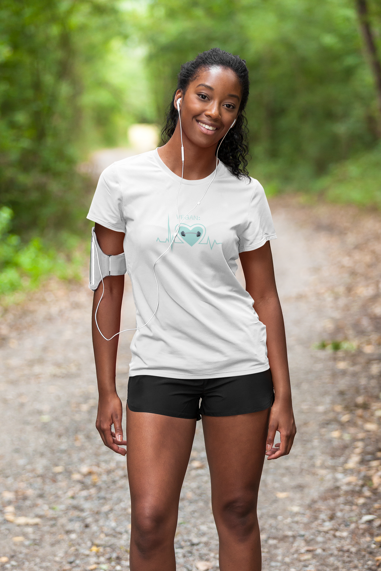 vegan heartbeat t-shirt with a dumbbell, on white premium cotton worn by a runner on a path