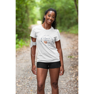 woman running on a nature trail  wearing a vegan t shirt saying vegan to reverse heart disease